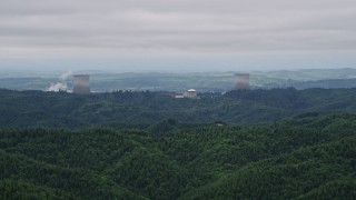 AX57_004E - 5K aerial stock footage of Satsop Nuclear Power Plant cooling towers in Satsop, Washington