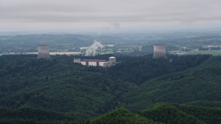 5K aerial stock footage of Satsop Nuclear Power Plant cooling towers surrounded by forest, Satsop, Washington Aerial Stock Footage | AX57_007E