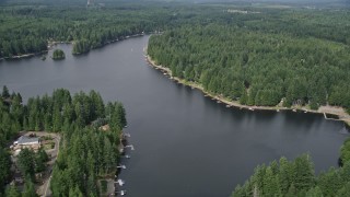 AX58_008 - 5K aerial stock footage fly over lakeside homes and docks at Lake Limerick, Shelton, Washington