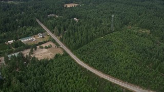 5K aerial stock footage of rural homes and buildings beside Mason Benson Road, Grapeview, Washington Aerial Stock Footage | AX58_014