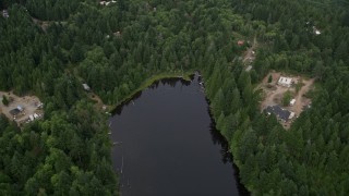 5K aerial stock footage of bird's eye view of lakefront homes and evergreen trees in Grapeview, Washington Aerial Stock Footage | AX58_018