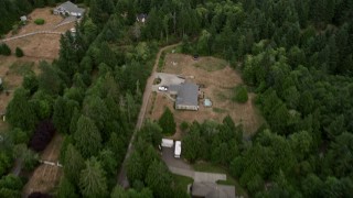 5K aerial stock footage tilt from rural homes to approach marsh in Burley Lagoon, Gig Harbor, Washington Aerial Stock Footage | AX58_045E