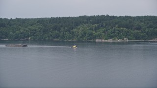 5K aerial stock footage approach a tugboat on Colvos Passage by Vashon Island, Washington Aerial Stock Footage | AX58_054