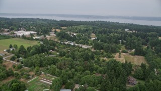 5K aerial stock footage fly over small farms and rural homes on the way to the shore of Vashon Island, Washington Aerial Stock Footage | AX58_061E