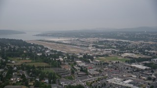 AX58_080E - 5K aerial stock footage approach the Renton Municipal Airport runway in Washington