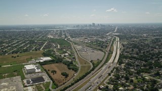 5K aerial stock footage fly over I-10 through Gentilly to approach Downtown New Orleans, Louisiana skyline Aerial Stock Footage | AX59_002