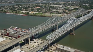 AX59_009 - 5K aerial stock footage of Crescent City Connection Bridge spanning the Mississippi River, New Orleans, Louisiana