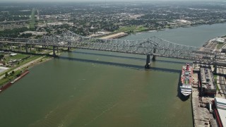 AX59_025 - 5K aerial stock footage track light traffic crossing the Crescent City Connection Bridge, New Orleans, Louisiana