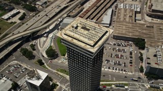 AX59_037 - 5K aerial stock footage of the top of Plaza Tower in Downtown New Orleans, Louisiana