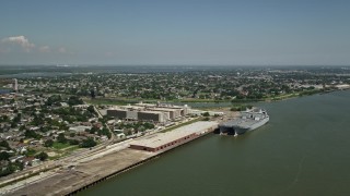 5K aerial stock footage of two military transport ships docked at Bywater, New Orleans, Louisiana Aerial Stock Footage | AX59_046