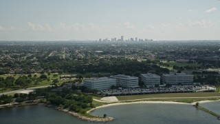 5K aerial stock footage of office buildings by Lake Pontchartrain, and view of Downtown New Orleans skyline, Louisiana Aerial Stock Footage | AX60_002