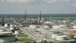 5K aerial stock footage of oil tanks and flare stacks at the Marathon Garyville Refinery in Reserve, Louisiana Aerial Stock Footage | AX60_021