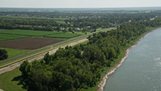 5K aerial stock footage follow State Route 18 past rural homes and fields in Vacherie, Louisiana Aerial Stock Footage | AX60_034