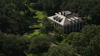 AX60_041E - 5K aerial stock footage flyby trees to reveal Oak Valley Plantation in Vacherie, Louisiana