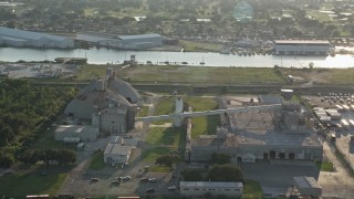 5K aerial stock footage of a factory near Industrial Canal at sunset, New Orleans, Louisiana Aerial Stock Footage | AX61_001