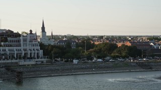 AX61_010 - 5K aerial stock footage flyby Steamboat Natchez and Jax Brewery to reveal St. Louis Cathedral and Jackson Square at sunset, New Orleans, Louisiana