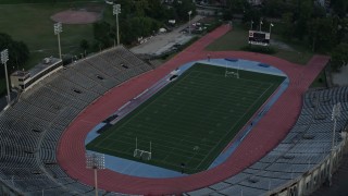 5K aerial stock footage approach Tad Gormley Stadium in City Park at sunset, New Orleans, Louisiana Aerial Stock Footage | AX61_033