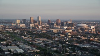 5K aerial stock footage approach skyscrapers in Downtown New Orleans at sunset, Louisiana Aerial Stock Footage | AX61_035