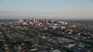 5K aerial stock footage approach high-rises and skyscrapers in Downtown New Orleans at sunset, Louisiana Aerial Stock Footage | AX61_036