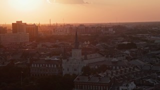 5K aerial stock footage approach the French Quarter's St. Louis Cathedral from the river at sunset, New Orleans, Louisiana Aerial Stock Footage | AX61_053