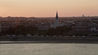 5K aerial stock footage of St. Louis Cathedral at sunset in the French Quarter of New Orleans, Louisiana Aerial Stock Footage | AX61_055