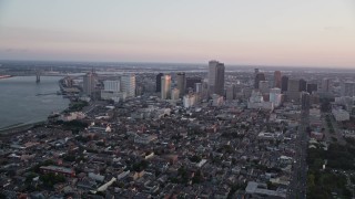 5K aerial stock footage of a view across the French Quarter at Downtown New Orleans at sunset, Louisiana Aerial Stock Footage | AX61_062