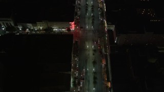 5K aerial stock footage of bird's eye view of Canal Street through Downtown New Orleans at night, Louisiana Aerial Stock Footage | AX62_019