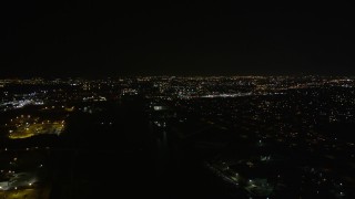 AX63_002 - 5K aerial stock footage fly over Industrial Canal to approach Gentilly at night, New Orleans, Louisiana