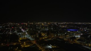 5K aerial stock footage of a wide view of Downtown New Orleans at night, Louisiana Aerial Stock Footage | AX63_028