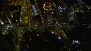 AX63_029E - 5K aerial stock footage of a bird's eye view of the French Quarter, including Bourbon Street, at night, and reveal Downtown New Orleans, Louisiana