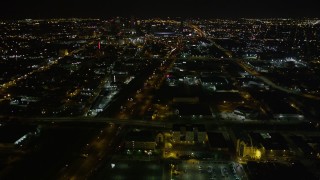 5K aerial stock footage approach Xavier University, pan to follow I-10 toward Superdome and downtown at night in Mid-City New Orleans, Louisiana Aerial Stock Footage | AX63_037E