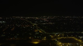 5K aerial stock footage flyby warehouse buildings and neighborhoods in New Orleans East at night, Louisiana Aerial Stock Footage | AX63_048E