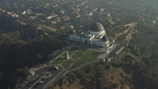 5K aerial stock footage approach the Griffith Observatory in haze, Los Angeles, California Aerial Stock Footage | AX64_0019E