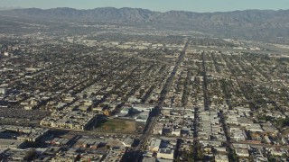 5K aerial stock footage pan across suburban neighborhoods to reveal the Burbank Airport, California Aerial Stock Footage | AX64_0026