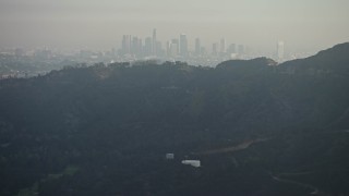 5K aerial stock footage of Downtown Los Angeles skyline seen from the Hollywood Hills, California Aerial Stock Footage | AX64_0066