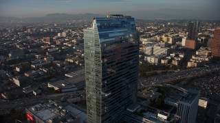 AX64_0089E - 5K aerial stock footage fly around Staples Center and Ritz-Carlton to reveal skyscrapers in Downtown Los Angeles, California