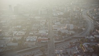 5K aerial stock footage follow Hollywood Boulevard in Los Angeles, California, sunset Aerial Stock Footage | AX64_0115