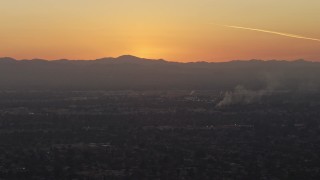 5K aerial stock footage of suburban neighborhoods and mountains in Pacoima, California, sunset Aerial Stock Footage | AX64_0144