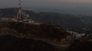 5K aerial stock footage of radio tower above Hollywood Sign, Los Angeles, California, twilight Aerial Stock Footage | AX64_0164E