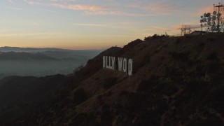 5K aerial stock footage flyby the radio tower to reveal the Hollywood Sign, Los Angeles, California, twilight Aerial Stock Footage | AX64_0166E