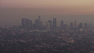 5K aerial stock footage of the Downtown Los Angeles skyline in haze, California, twilight Aerial Stock Footage | AX64_0176