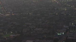 5K aerial stock footage of a police helicopter flying over Downtown Los Angeles, California, twilight Aerial Stock Footage | AX64_0198