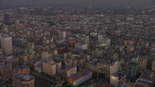 AX64_0202 - 5K aerial stock footage flyby office buildings in Downtown Los Angeles, California, twilight