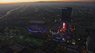 AX64_0216E - 5K aerial stock footage of Staples Center arena and The Ritz-Carlton hotel, Downtown Los Angeles, California, twilight