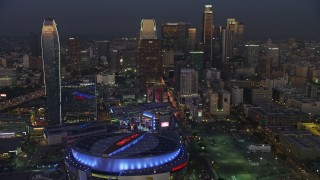 AX64_0224E - 5K aerial stock footage of 110 Freeway, Downtown Los Angeles skyscrapers, The Ritz-Carlton, Staples Center, California, twilight