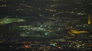 5K aerial stock footage of tracking a helicopter and reveal Twin Towers prison, Downtown Los Angeles, California, Night Aerial Stock Footage | AX64_0254E