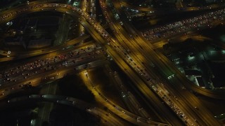 5K aerial stock footage of I-10 and 110 freeway interchange with heavy traffic, Downtown Los Angeles, California, night Aerial Stock Footage | AX64_0273E