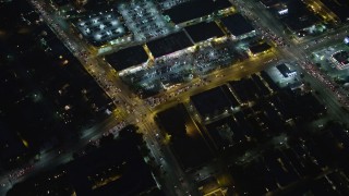 AX64_0288E - 5K aerial stock footage bird's eye view of Washington Boulevard, a strip mall, and urban neighborhood, Palms, Los Angeles, California, night