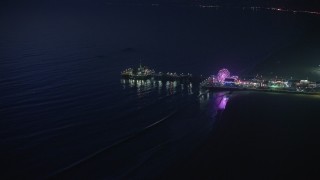 AX64_0299E - 5K aerial stock footage of a slow approach to the Santa Monica Pier and ferris wheel, Los Angeles, California