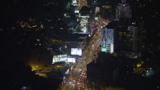 AX64_0329 - 5K aerial stock footage fly over cars on the Sunset Strip, West Hollywood, California, night